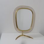 m23874 1950s Beautiful vanity mirror in brass with white perforated metal edge Vereinigte Werkstätten München / Germany