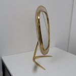 m23874 1950s Beautiful vanity mirror in brass with white perforated metal edge Vereinigte Werkstätten München / Germany