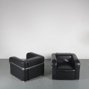 m24219 1950s Set of two impressive lounge chairs in chrome pipe frame with black skai upholstery Kovora / Czech