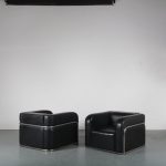 m24219 1950s Set of two impressive lounge chairs in chrome pipe frame with black skai upholstery Kovora / Czech