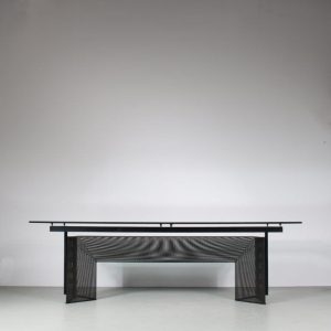 m26626 1980s "Tesi" dining table on black perforated metal base with glass top / Mario Botta / Alias, Italy