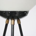 L5286 1950s Floor lamp in black metal with brass tripod base and milk glass hood Stilnovo, Italy